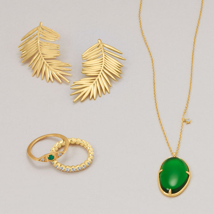 Earth Song Jewelry layout gold jewelry green stones