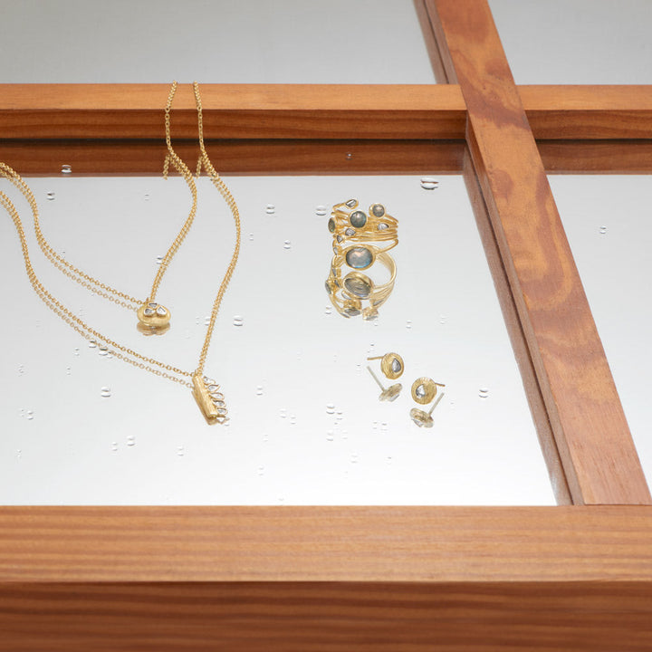 Earth Song Jewelry layout of gold raw polki diamond and labradorite jewelry