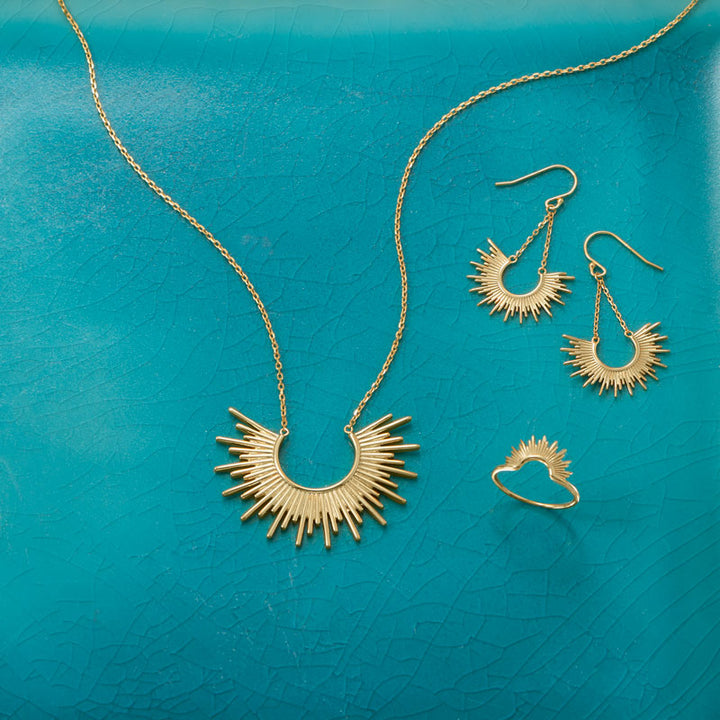 Earth Song Jewelry layout of gold sunburst jewelry set