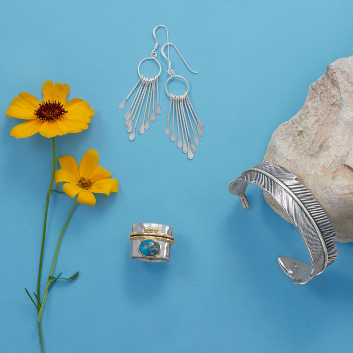 Earth Song Jewelry layout of sterling silver bracelet, ring and earrings