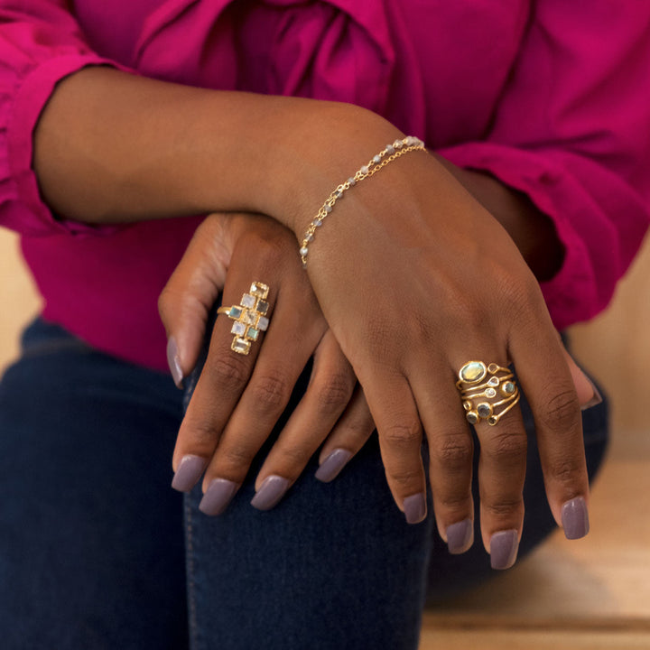 Earth Song Jewelry model showing gold polki diamond and labradorite jewelry
