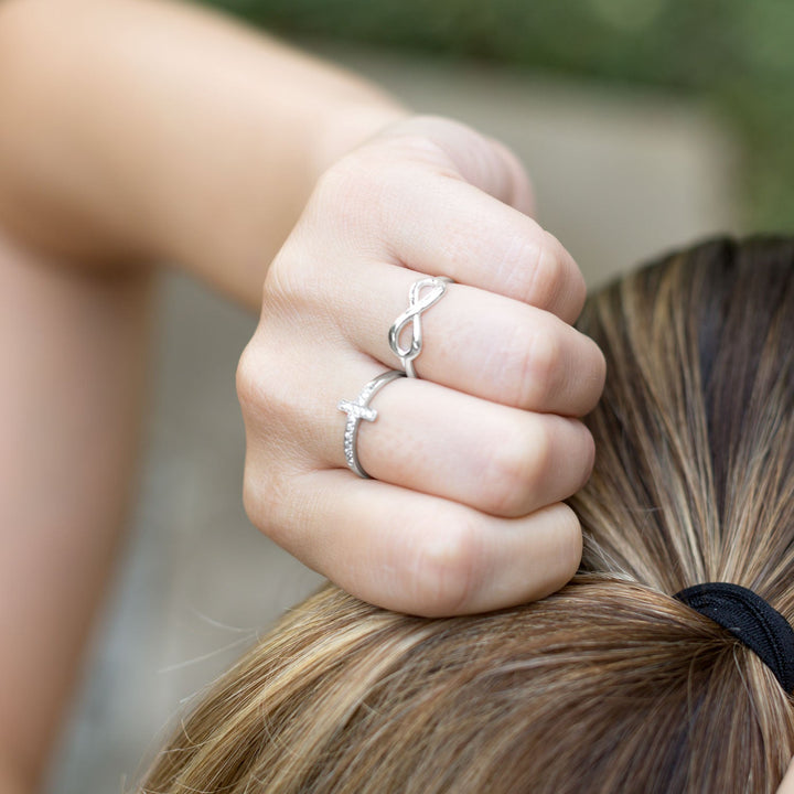 Earth Song Jewelry model wearing sterling silver infinity ring
