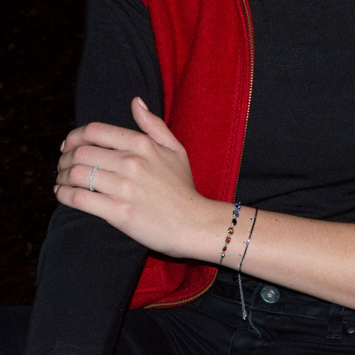 Earth Song Jewelry model wearing sterling silver jewelry and CZ crystal stacking ring