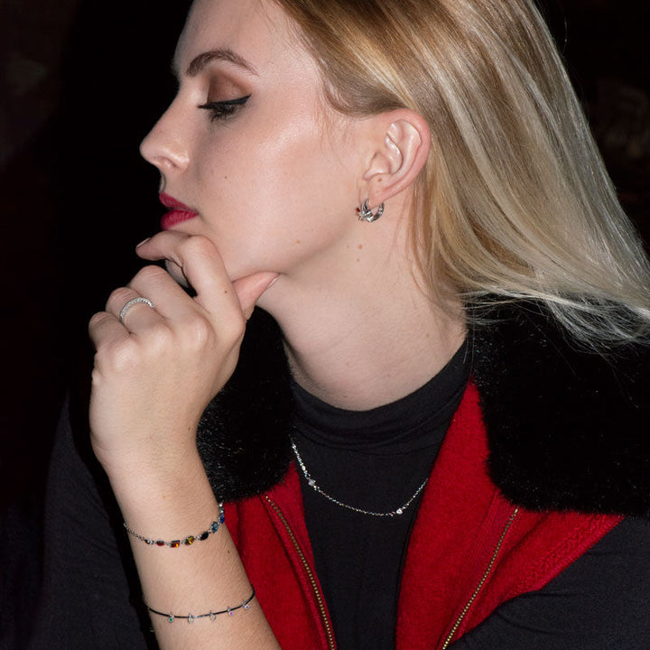 Earth Song Jewelry model wearing sterling silver jewelry set and CZ crystal stacking ring