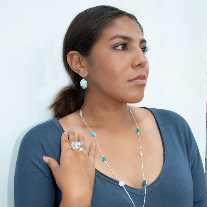 Earth Song Jewelry model wearing sterling silver larimar jewelry