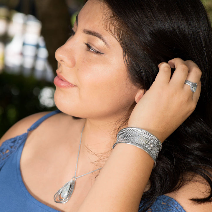 Earth Song Jewelry model wearing woven cuff bracelet