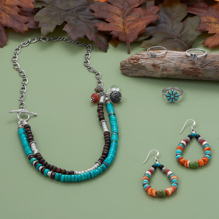 Earth Song Jewelry sterling silver jewelry collection laid out