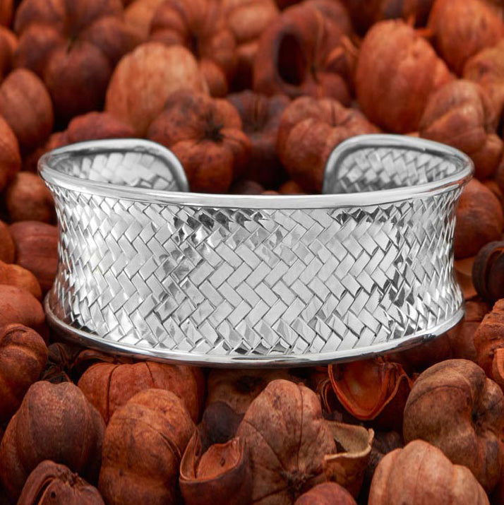Earth Song Jewelry sterling silver woven cuff bracelet on nuts background