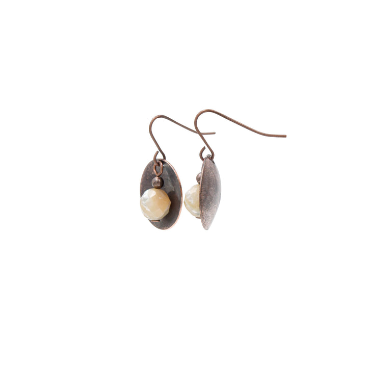 Earth Song Jewelry ~ Pearl earrings has iridescent areas, flashes and stripes of white and tan flakes for add dimension.