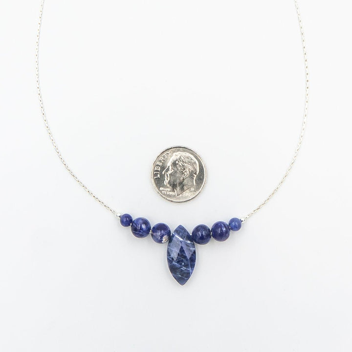 Earth Song Jewelry ~ Sodalite stones combine intense blue with white lines and patches to create interesting patterns.