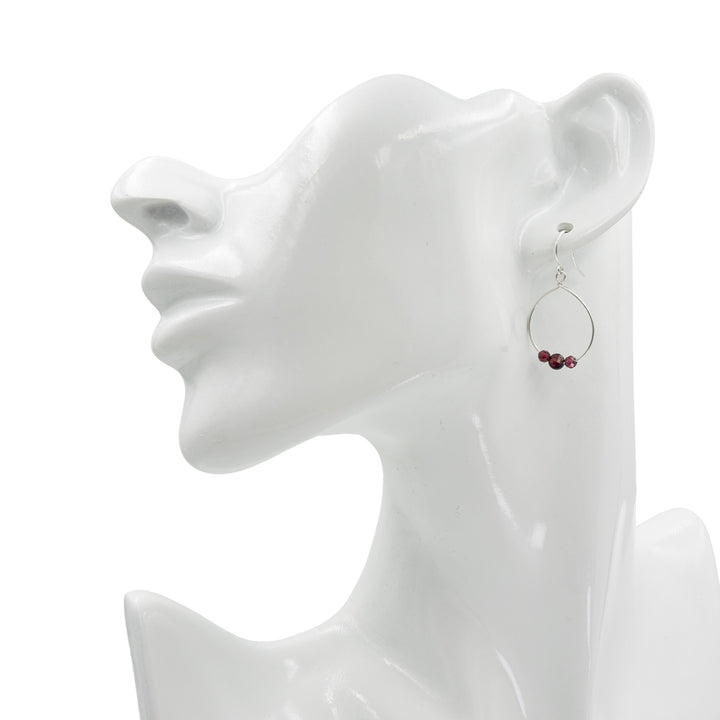 Earth Song Jewelry Handmade Sterling Silver Garnet Stone Loop Earrings on a head cast