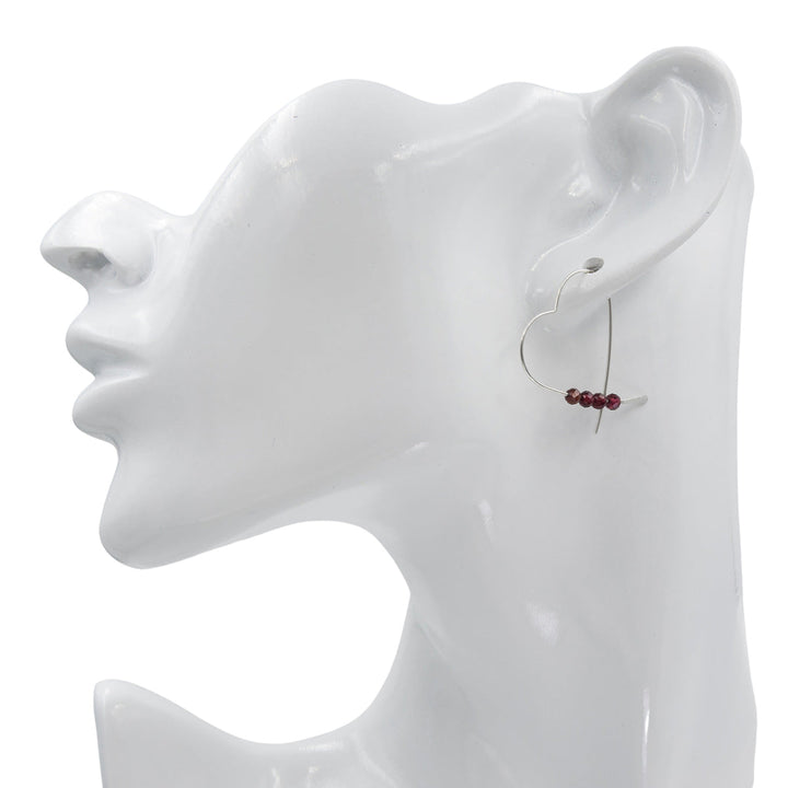 Earth Song Jewelry Handmade Sterling Silver Heart Earrings with Garnet stones on mannequin head