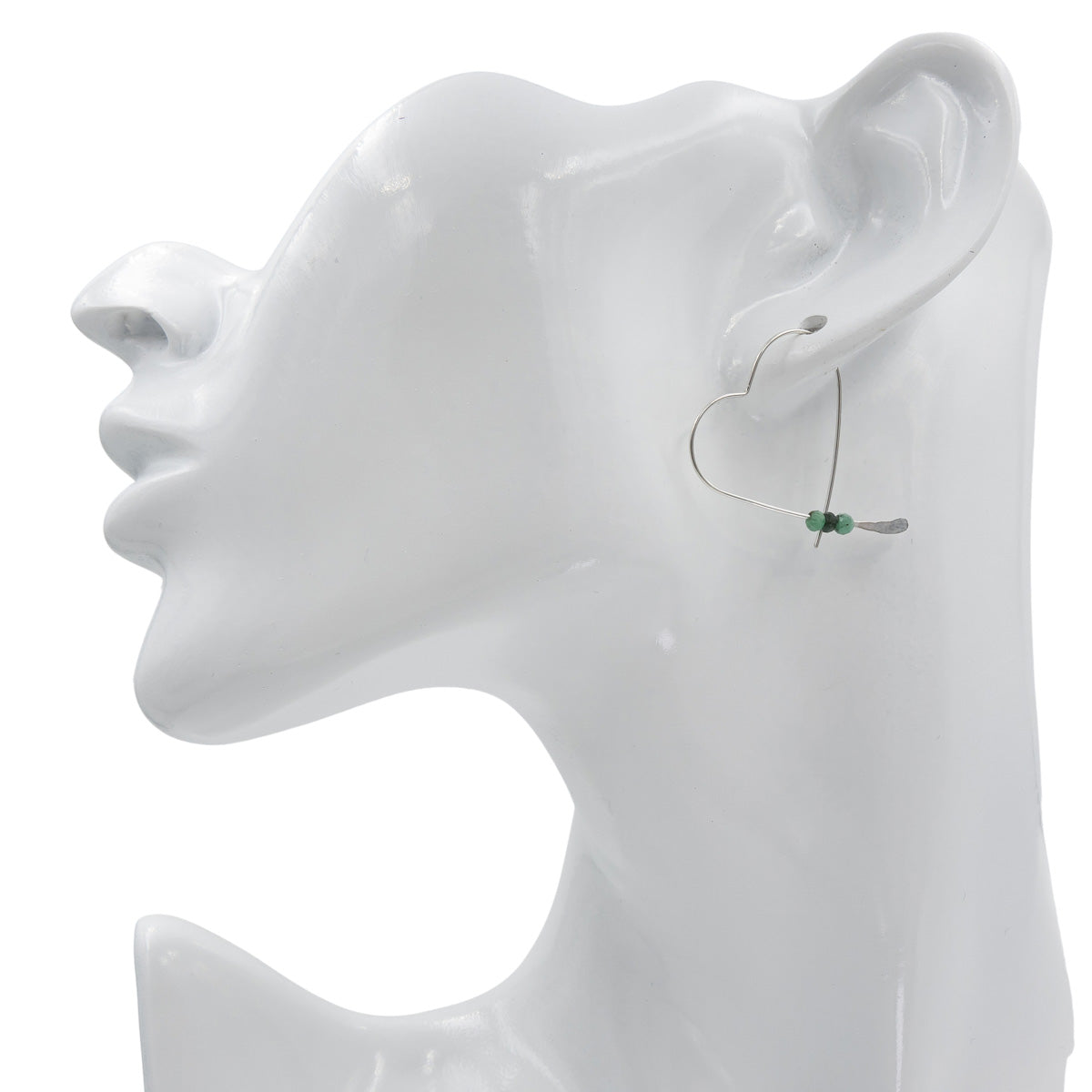 Earth Song Jewelry Handmade Sterling Silver Heart Earrings with Emerald stones on mannequin head